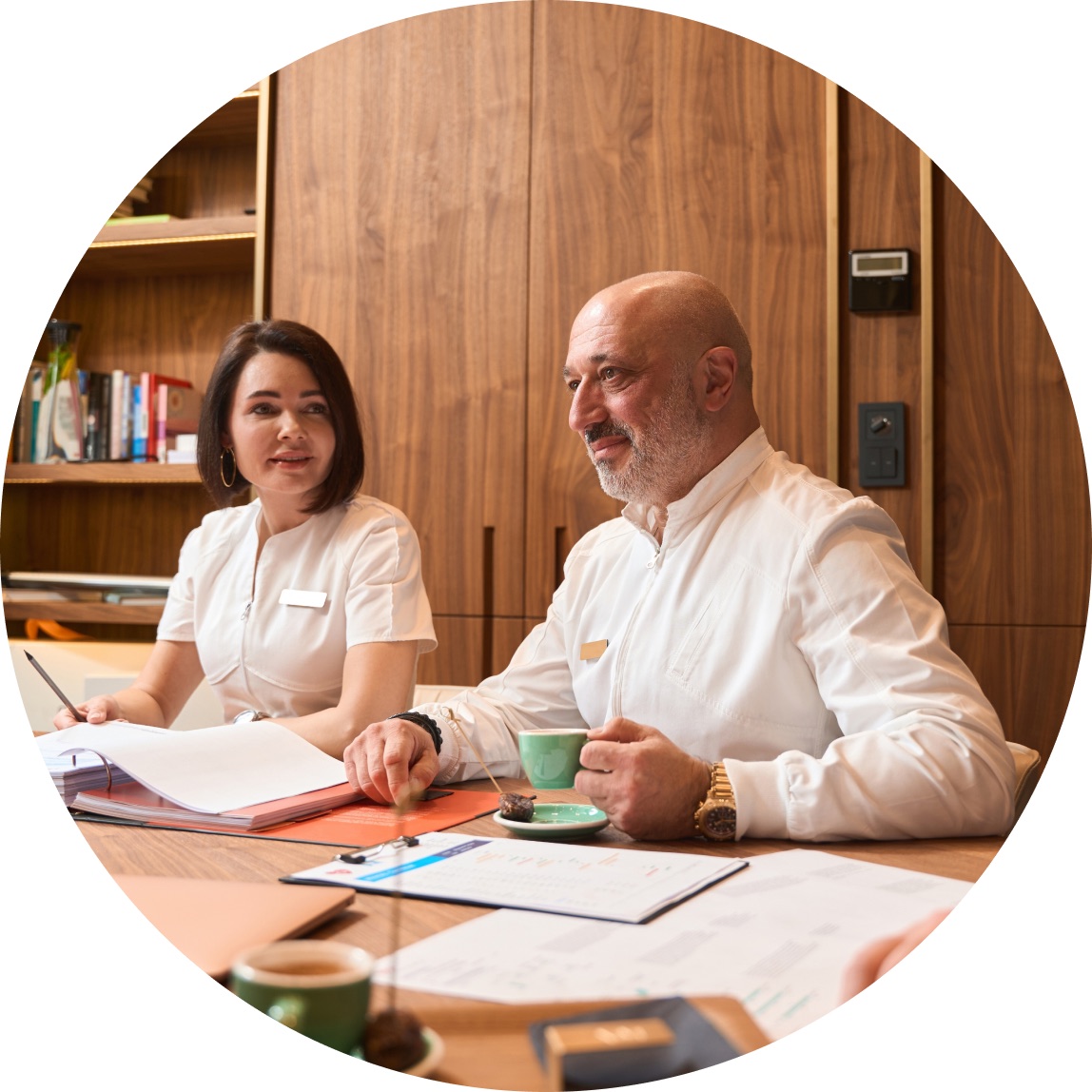 Two colleagues taking part in an autism awareness training session at a meeting table